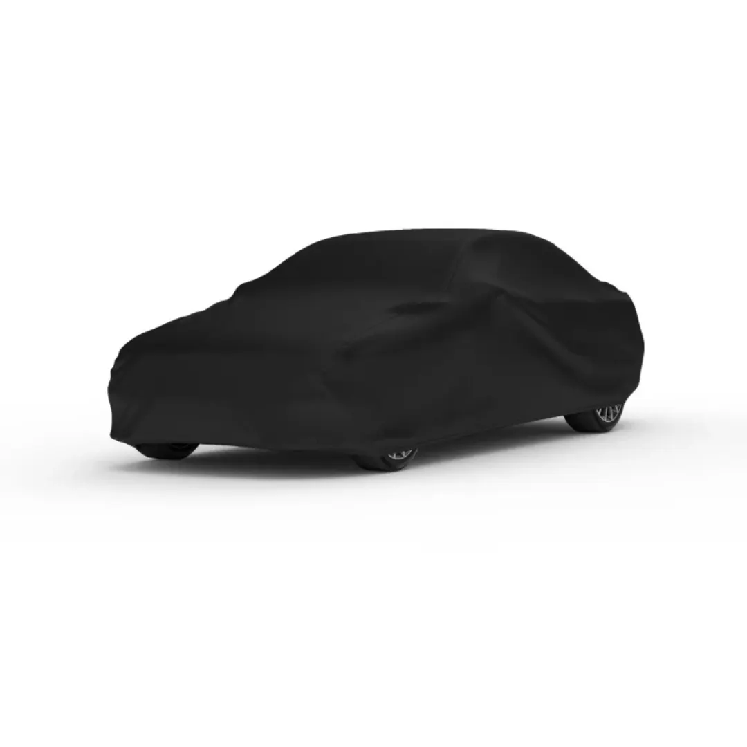 Car cover DEMIN full black dengan material satin premium menyelimuti siluet mobil secara sempurna, tampak bersih dan elegan difoto di atas background studio putih